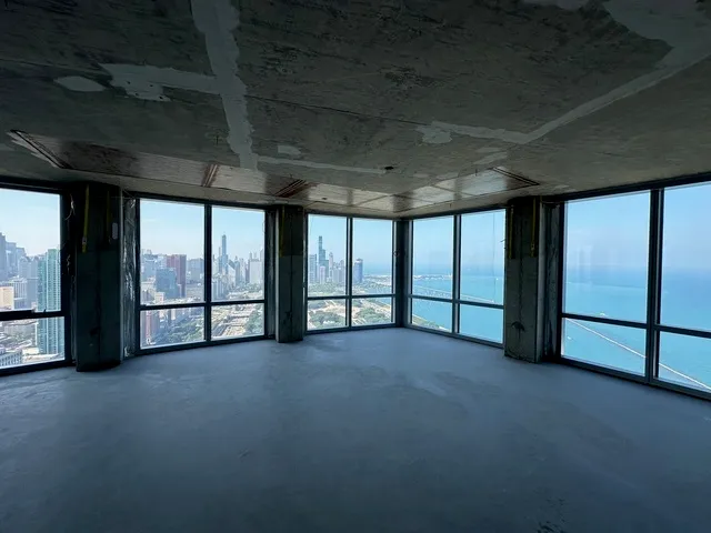 a view of an empty room with windows