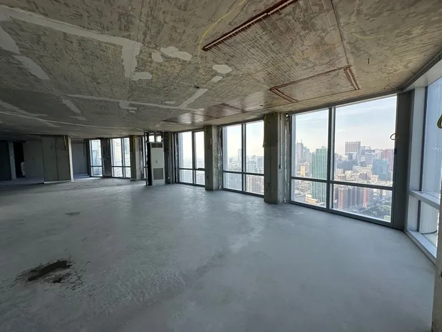 a view of an empty room with windows