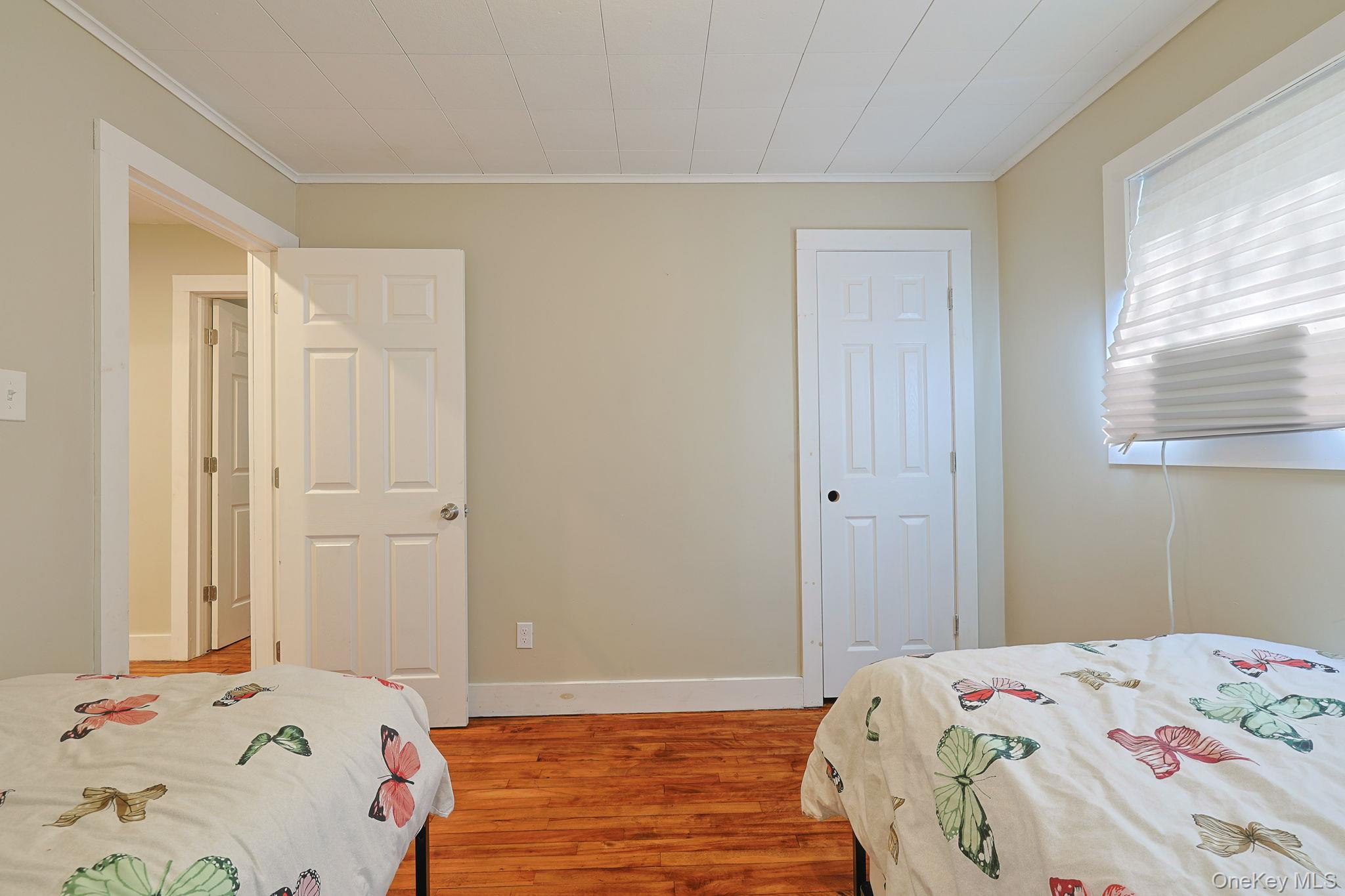30 Rock Ridge Avenue Monticello, NY 12701 - Photo 15 of 19 a bedroom with a bed and a window