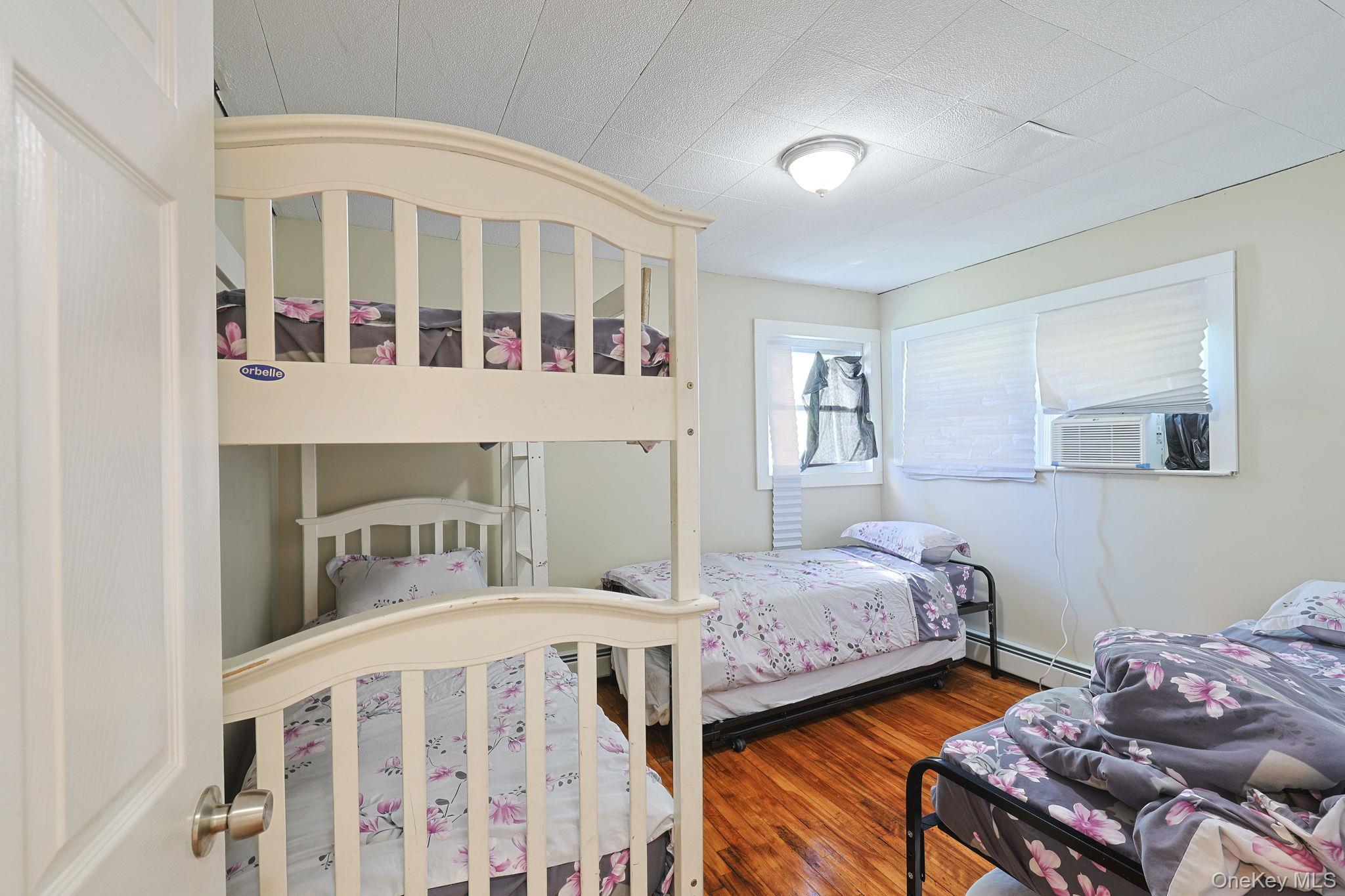 30 Rock Ridge Avenue Monticello, NY 12701 - Photo 16 of 19 a bedroom with furniture and baby crib