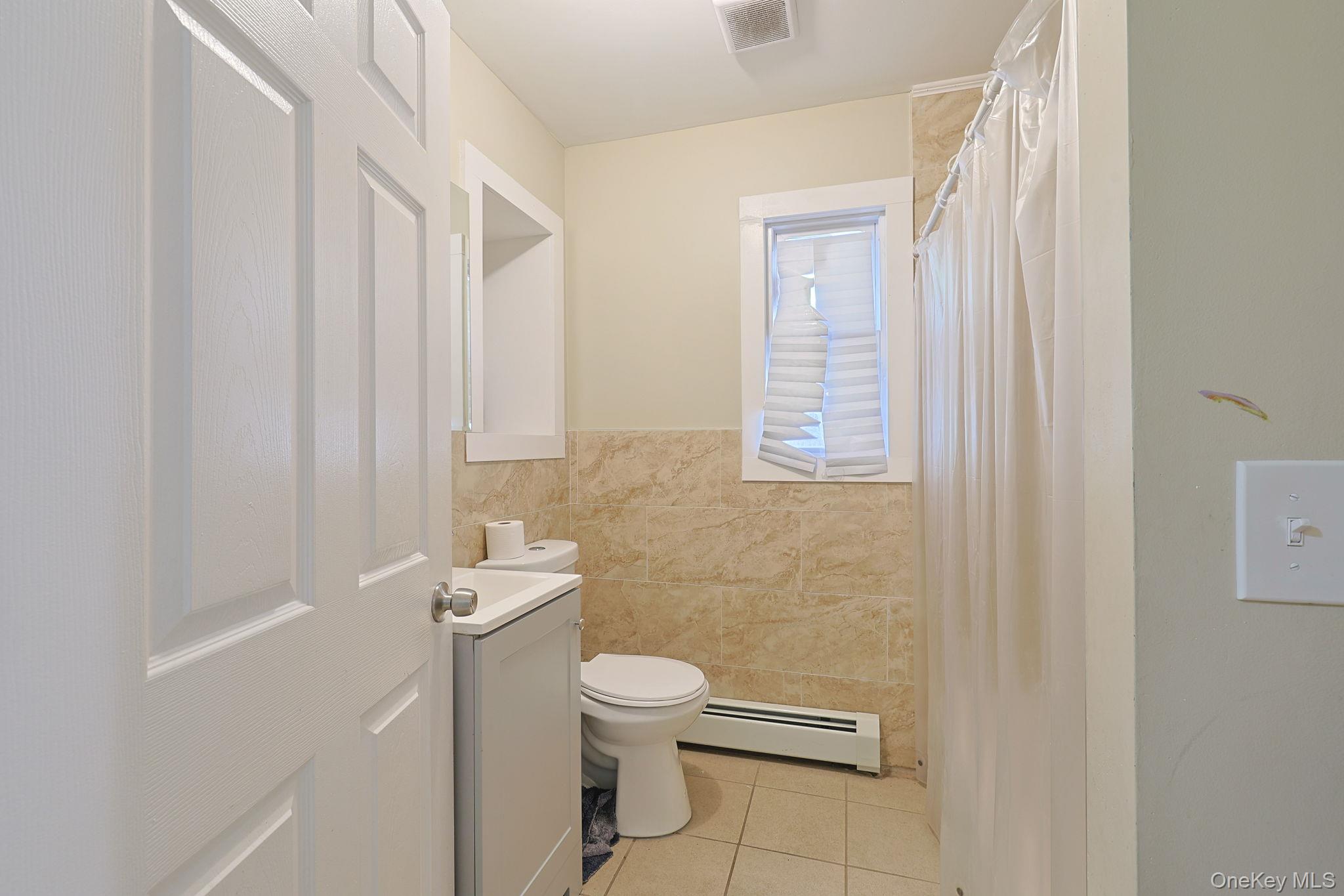 30 Rock Ridge Avenue Monticello, NY 12701 - Photo 18 of 19 a bathroom with a toilet a sink and a shower