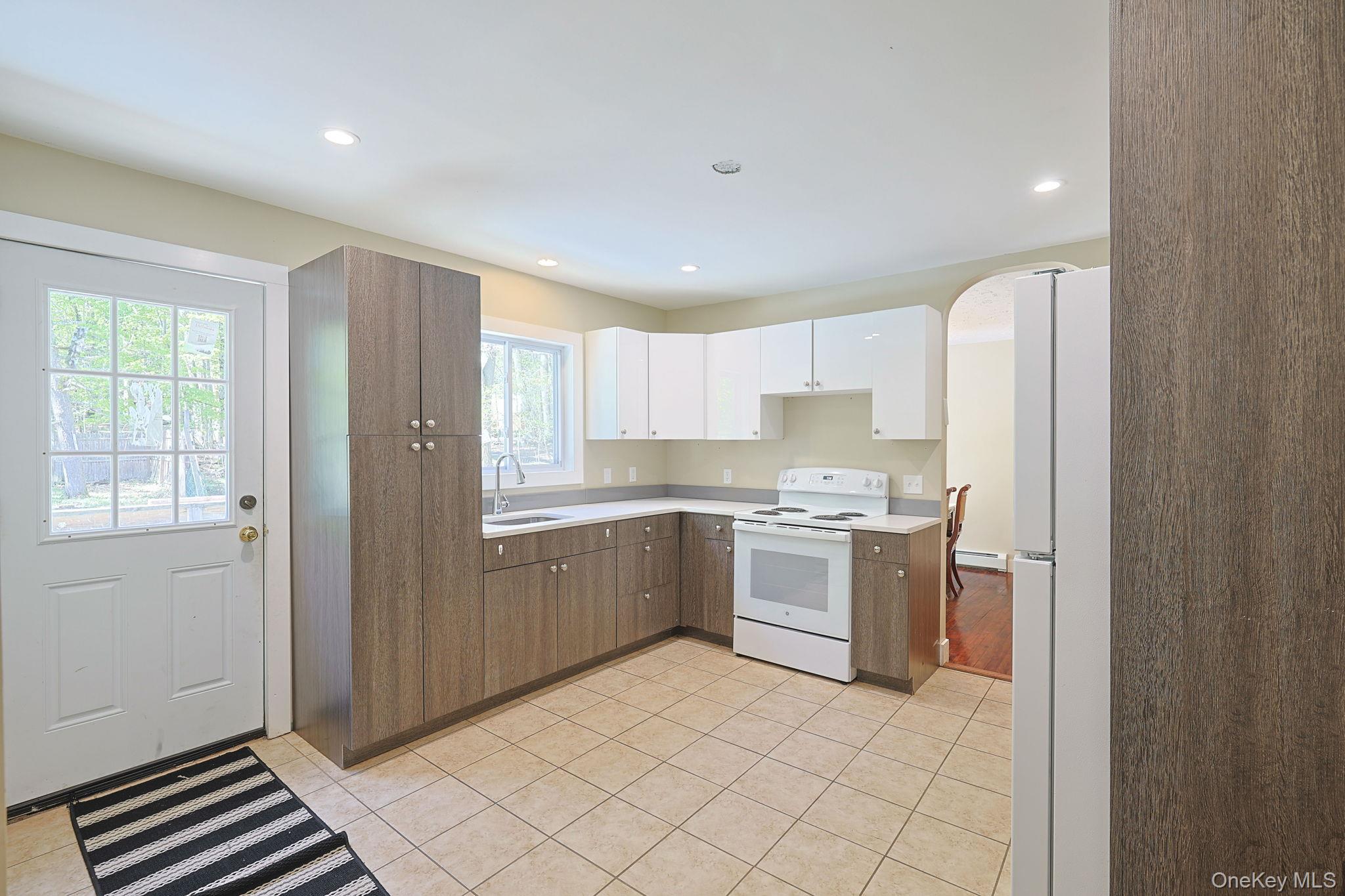 30 Rock Ridge Avenue Monticello, NY 12701 - Photo 3 of 19 a kitchen with a refrigerator and a sink