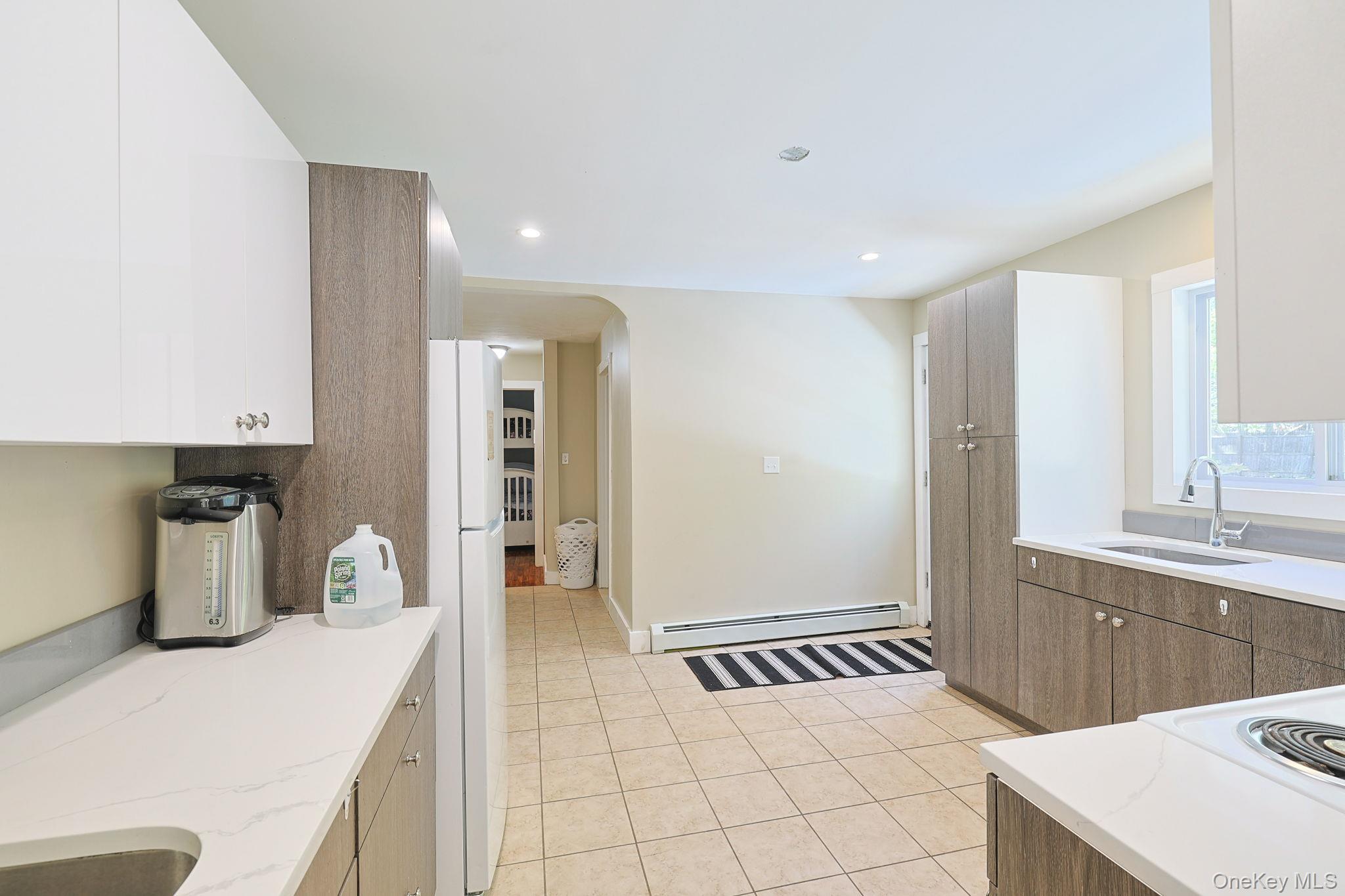 30 Rock Ridge Avenue Monticello, NY 12701 - Photo 4 of 19 a kitchen with a sink and cabinets
