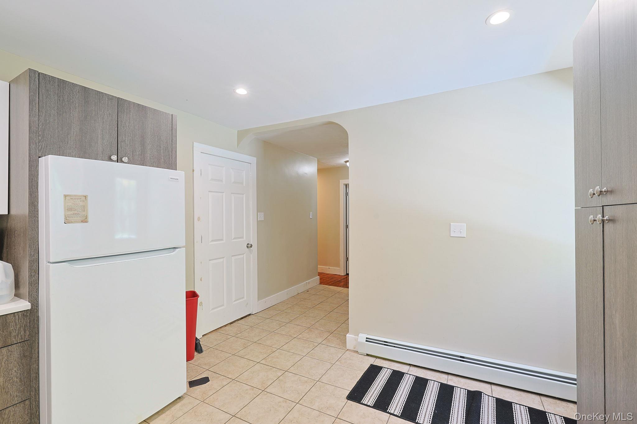 30 Rock Ridge Avenue Monticello, NY 12701 - Photo 5 of 19 a view of kitchen with refrigerator and cabinets