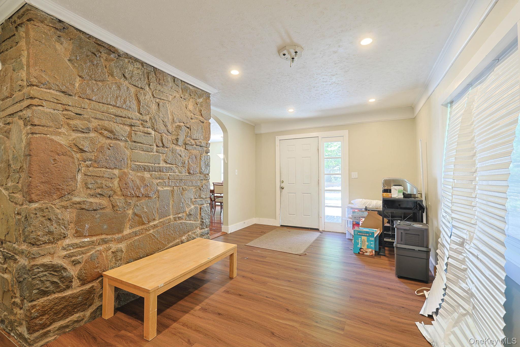 30 Rock Ridge Avenue Monticello, NY 12701 - Photo 6 of 19 a living room with stainless steel appliances kitchen island granite countertop furniture a rug and a window