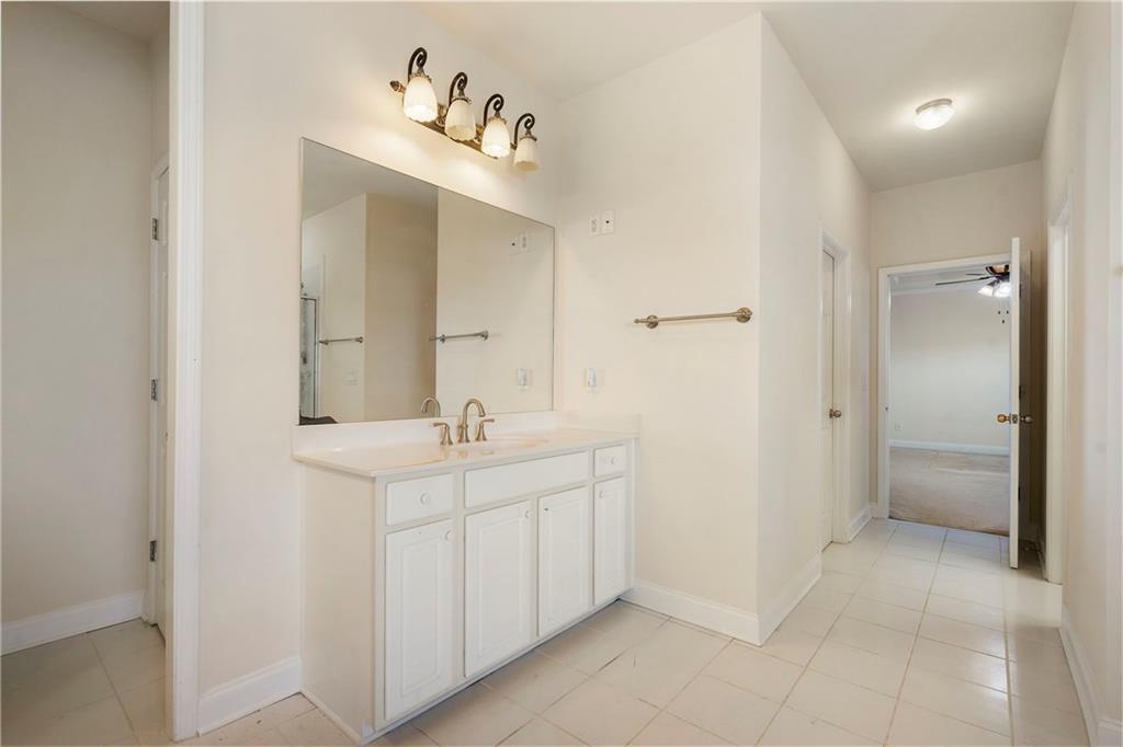 804 Morganton Drive Suwanee, GA 30024 - Photo 12 of 43 a spacious bathroom with a sink and a mirror