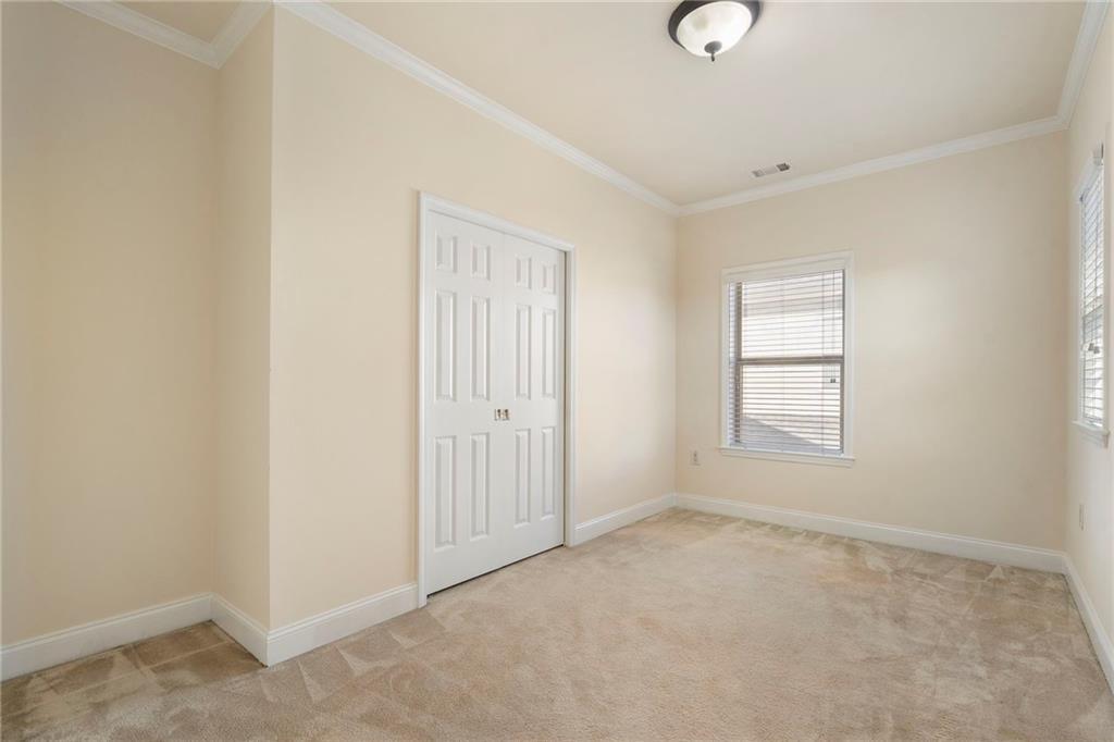 804 Morganton Drive Suwanee, GA 30024 - Photo 16 of 43 an empty room with windows