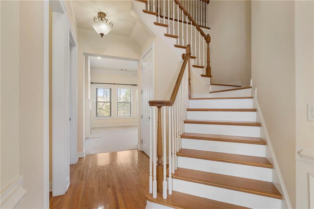 804 Morganton Drive Suwanee, GA 30024 - Photo 27 of 43 a view of entryway and hall with wooden floor