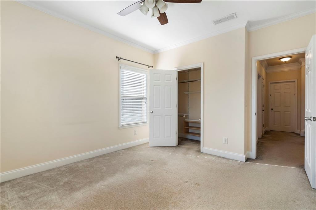 804 Morganton Drive Suwanee, GA 30024 - Photo 35 of 43 an empty room with closet and windows