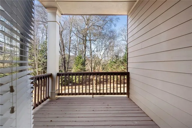 a view of a balcony with wooden floor