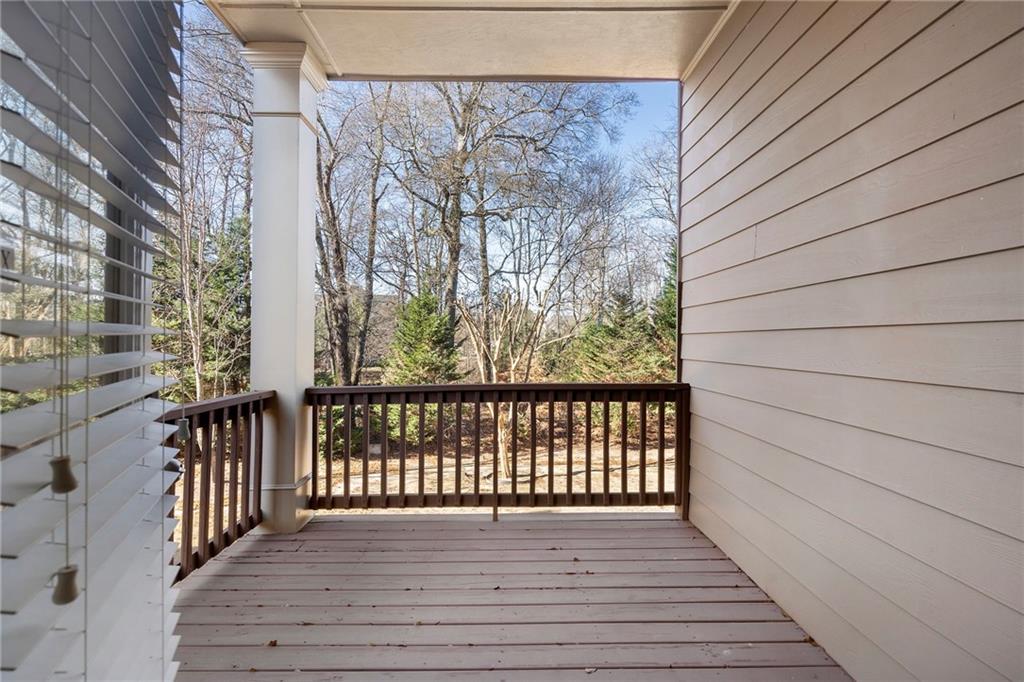 804 Morganton Drive Suwanee, GA 30024 - Photo 8 of 43 a view of a balcony with wooden floor