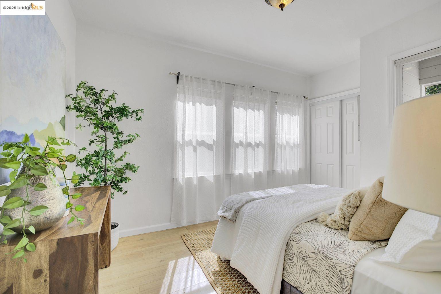 3830 Clarke Street Oakland, CA 94609 - Photo 14 of 41 a bedroom with a bed and a window