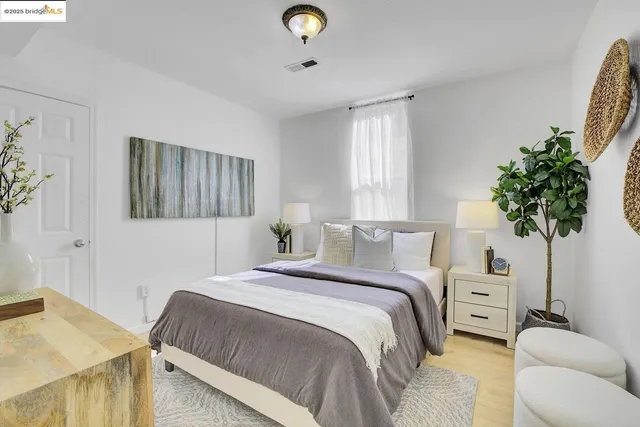 a bedroom with a bed and a couch