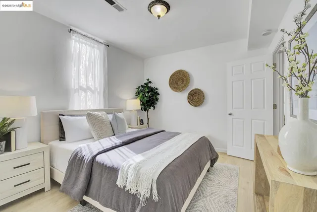 a bedroom with bed and a window