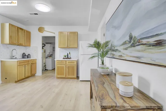 a room with a sink and a mirror