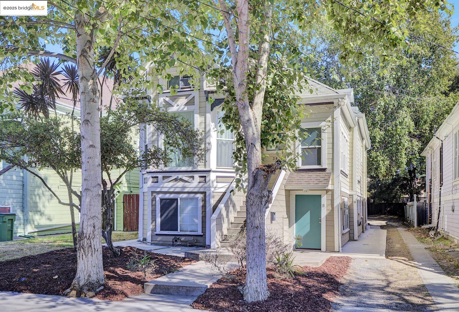 3830 Clarke Street Oakland, CA 94609 - Photo 2 of 41 a front view of a house with garden