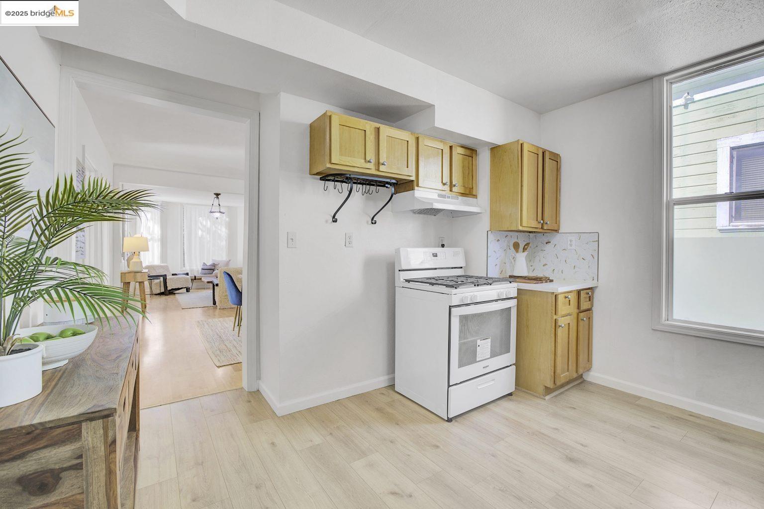 3830 Clarke Street Oakland, CA 94609 - Photo 24 of 41 a kitchen with a white stove top oven and sink