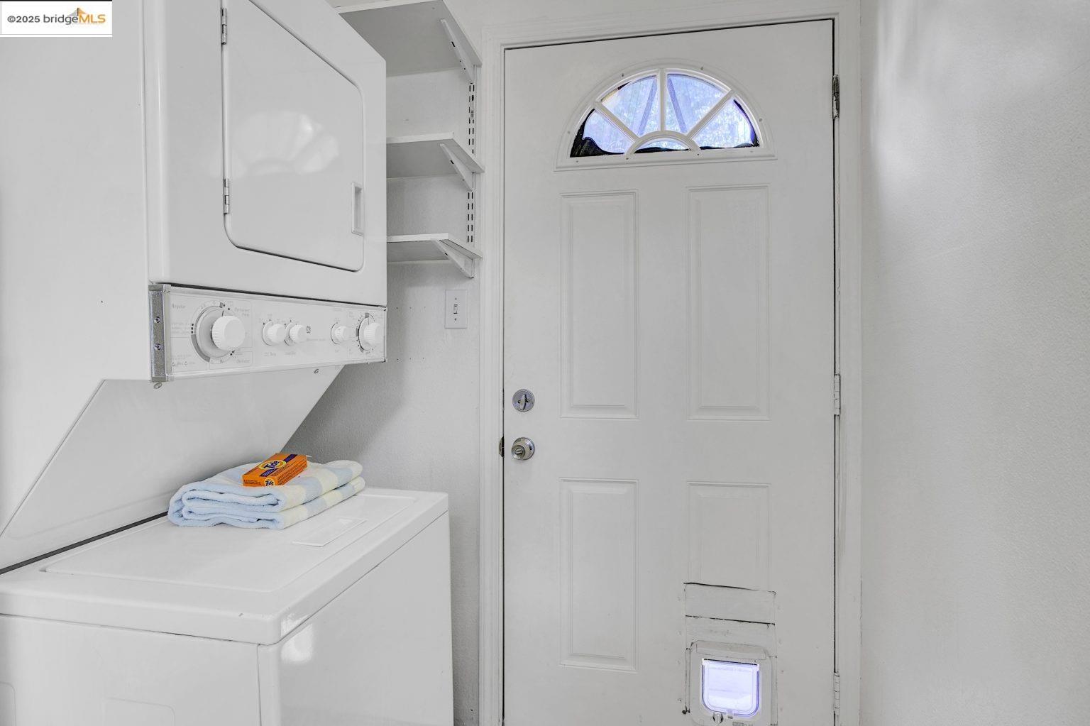 3830 Clarke Street Oakland, CA 94609 - Photo 25 of 41 a bedroom with a bed and a chandelier