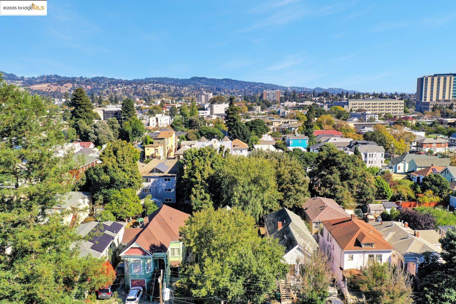 3830 Clarke Street Oakland, CA 94609 - Photo 36 of 41 an aerial view of residential houses with outdoor space and trees