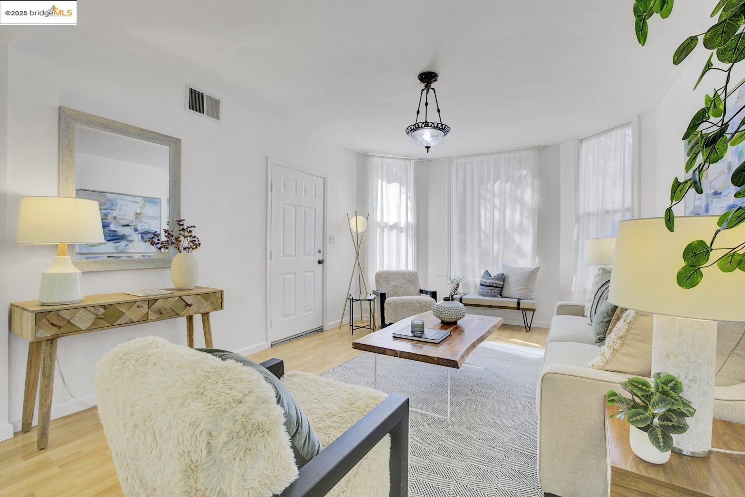 3830 Clarke Street Oakland, CA 94609 - Photo 7 of 41 a living room with furniture and wooden floor