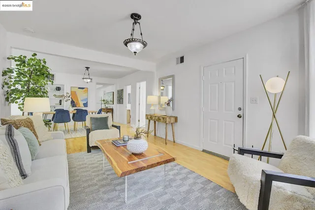 a living room with furniture and a rug