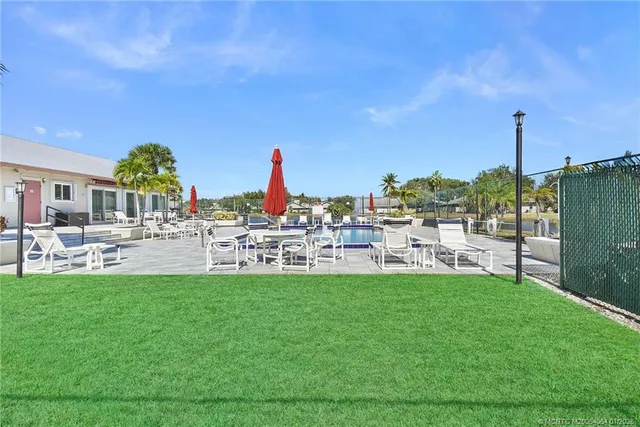 a view of a lake with houses in the background