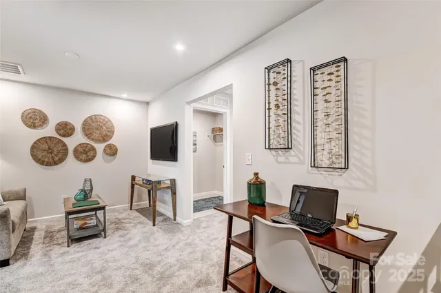 a view of a workspace with furniture