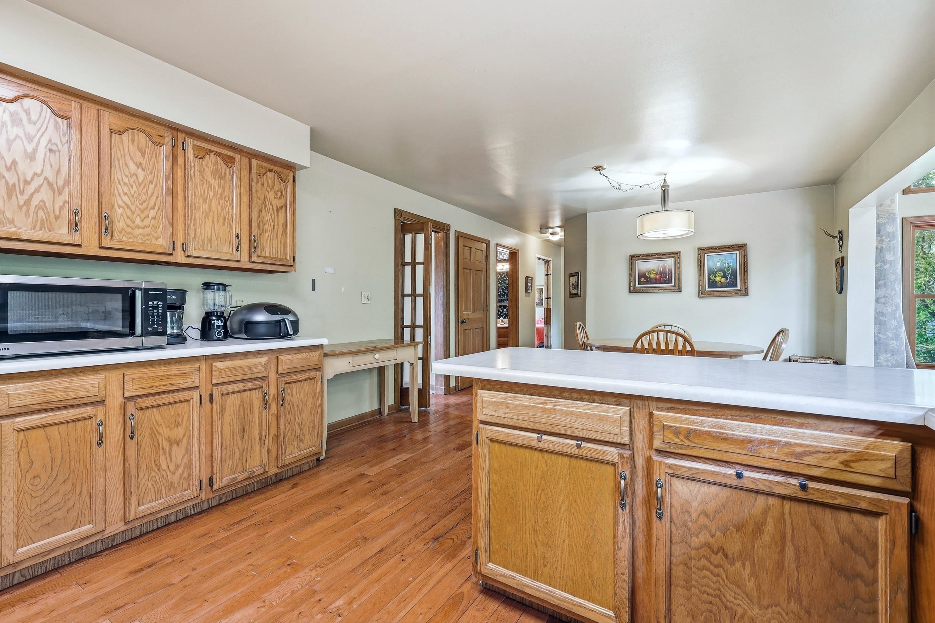 13 Signal Point Lane Galena, IL 61036 - Photo 18 of 47 a kitchen with stainless steel appliances granite countertop a sink a stove cabinets and wooden floor