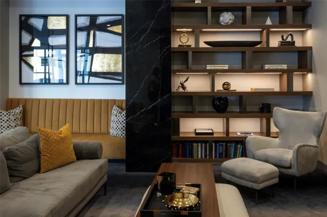 a living room with furniture and a piano