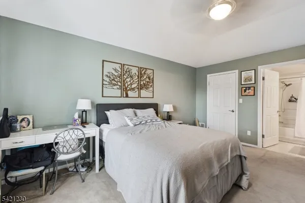 a bedroom with a bed and a table in it