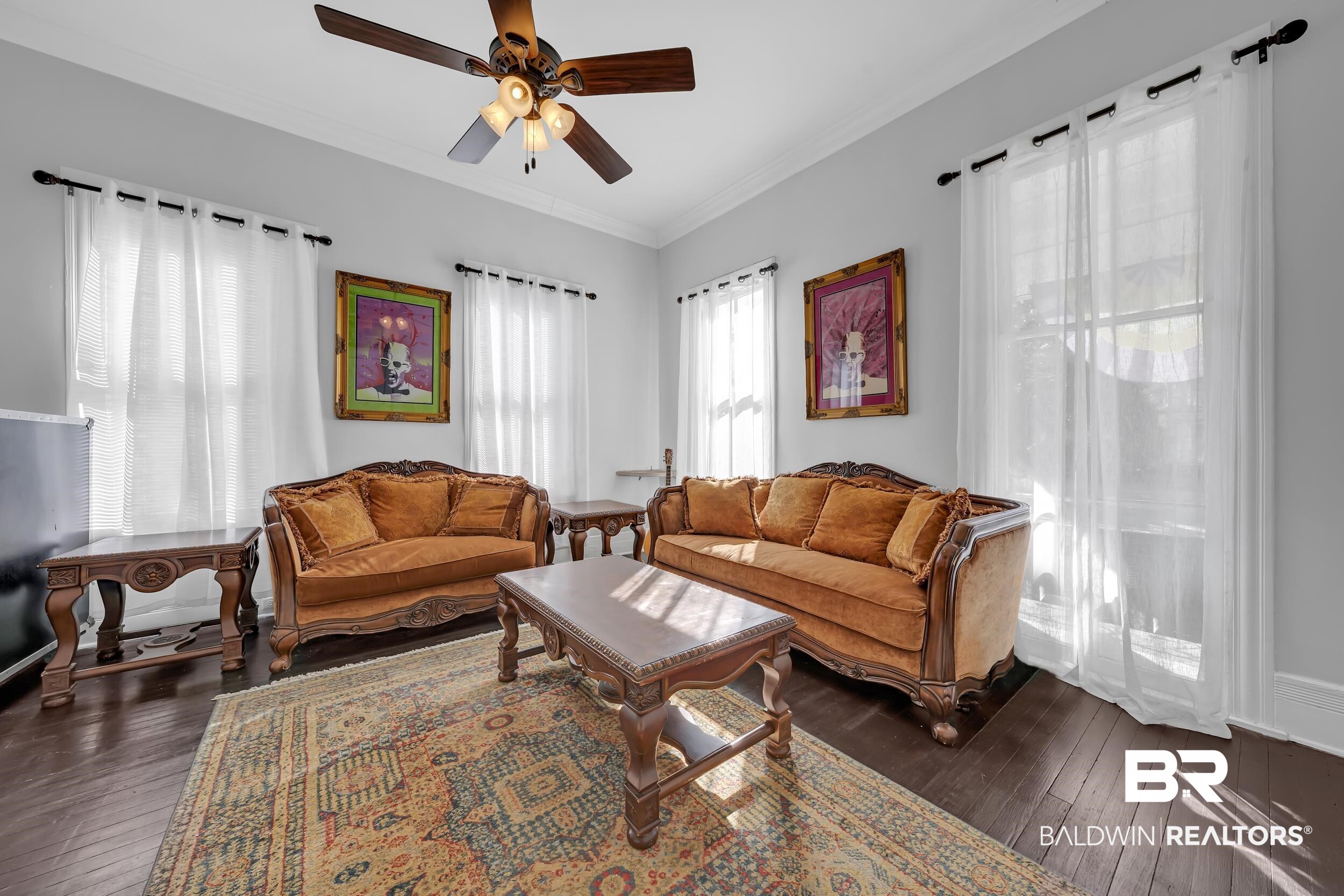 1322 Dauphin Street Mobile, AL 36604 - Photo 7 of 21 Living area with crown molding, a ceiling fan, and dark wood-style floors