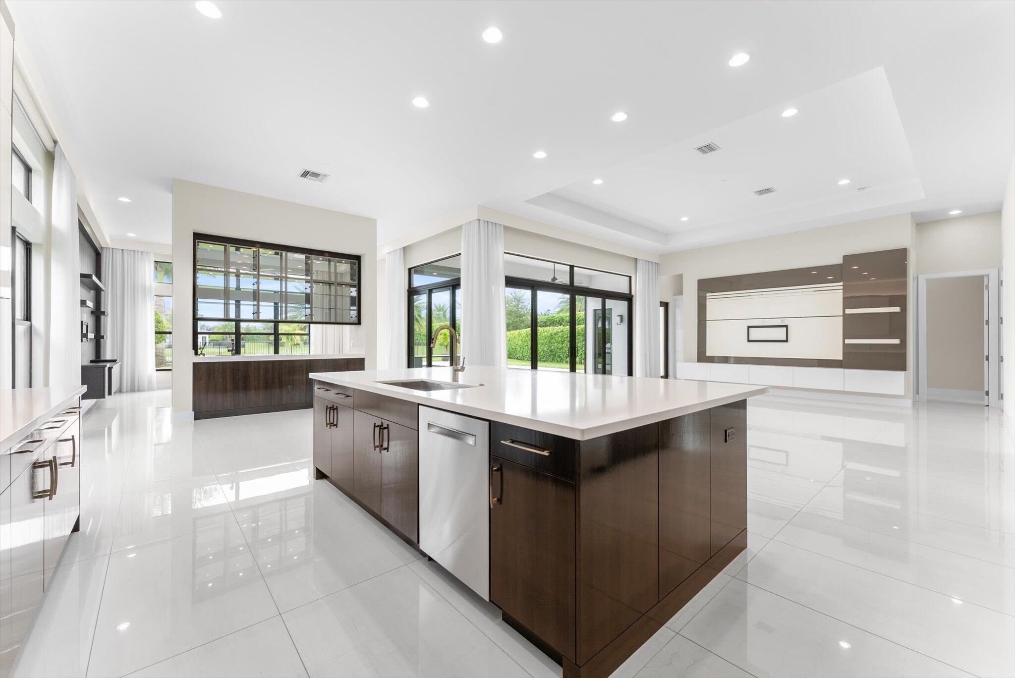 9794 Chianti Classico Terrace Boca Raton, FL 33496 - Photo 25 of 118 a large kitchen with granite countertop a large counter top and appliances