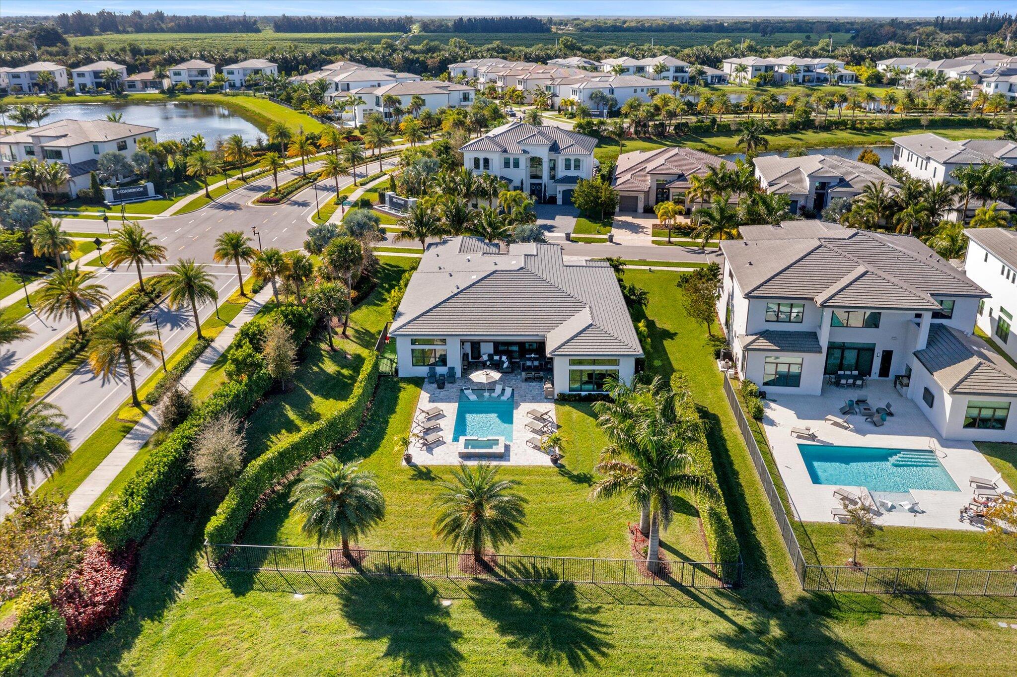 9794 Chianti Classico Terrace Boca Raton, FL 33496 - Photo 4 of 118 an aerial view of residential houses with outdoor space and swimming pool