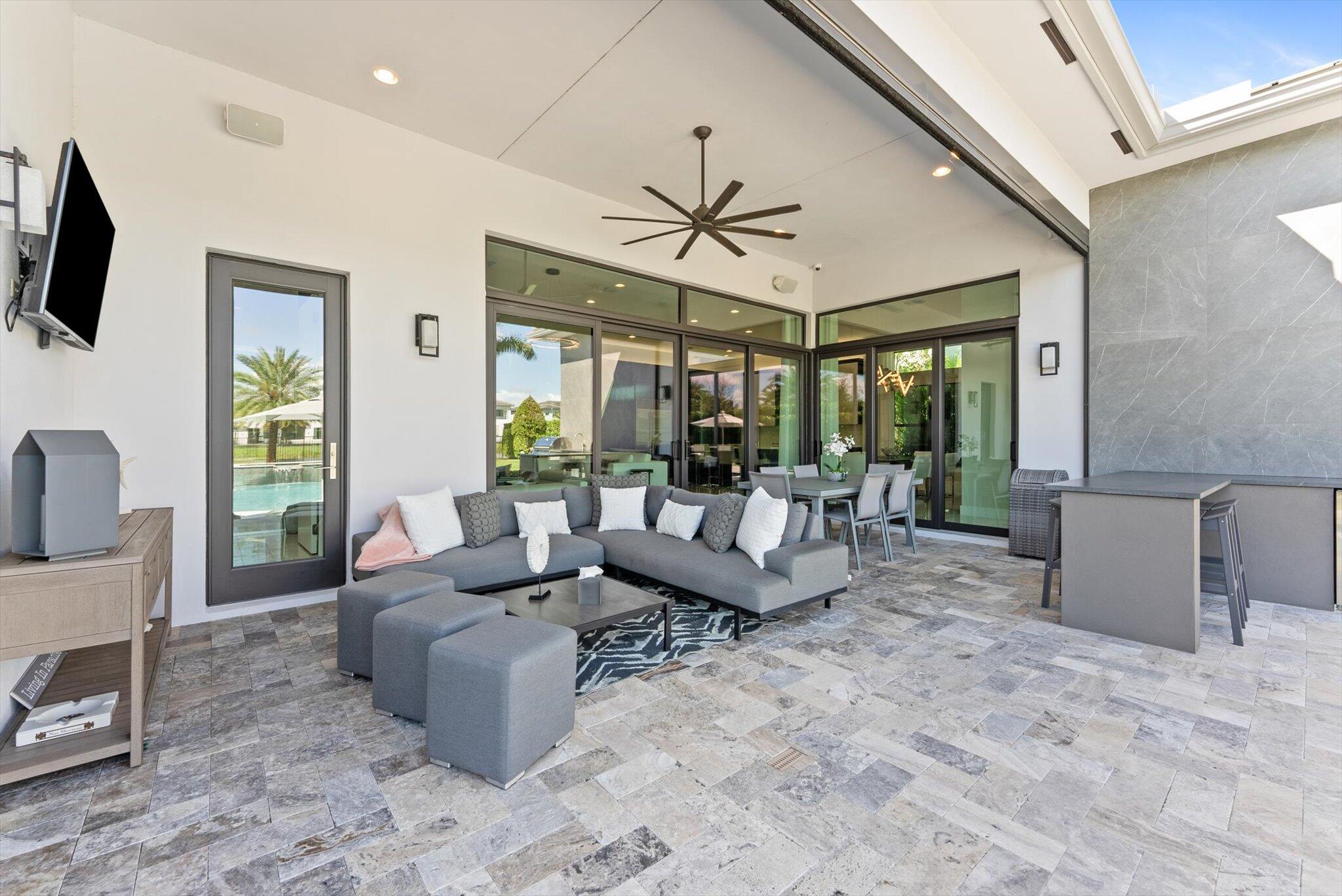 9794 Chianti Classico Terrace Boca Raton, FL 33496 - Photo 49 of 118 a living room with furniture and a flat screen tv