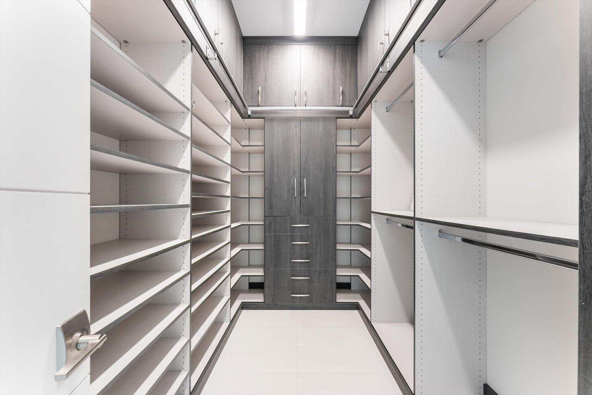 9794 Chianti Classico Terrace Boca Raton, FL 33496 - Photo 62 of 118 a view of walk in closet with empty racks