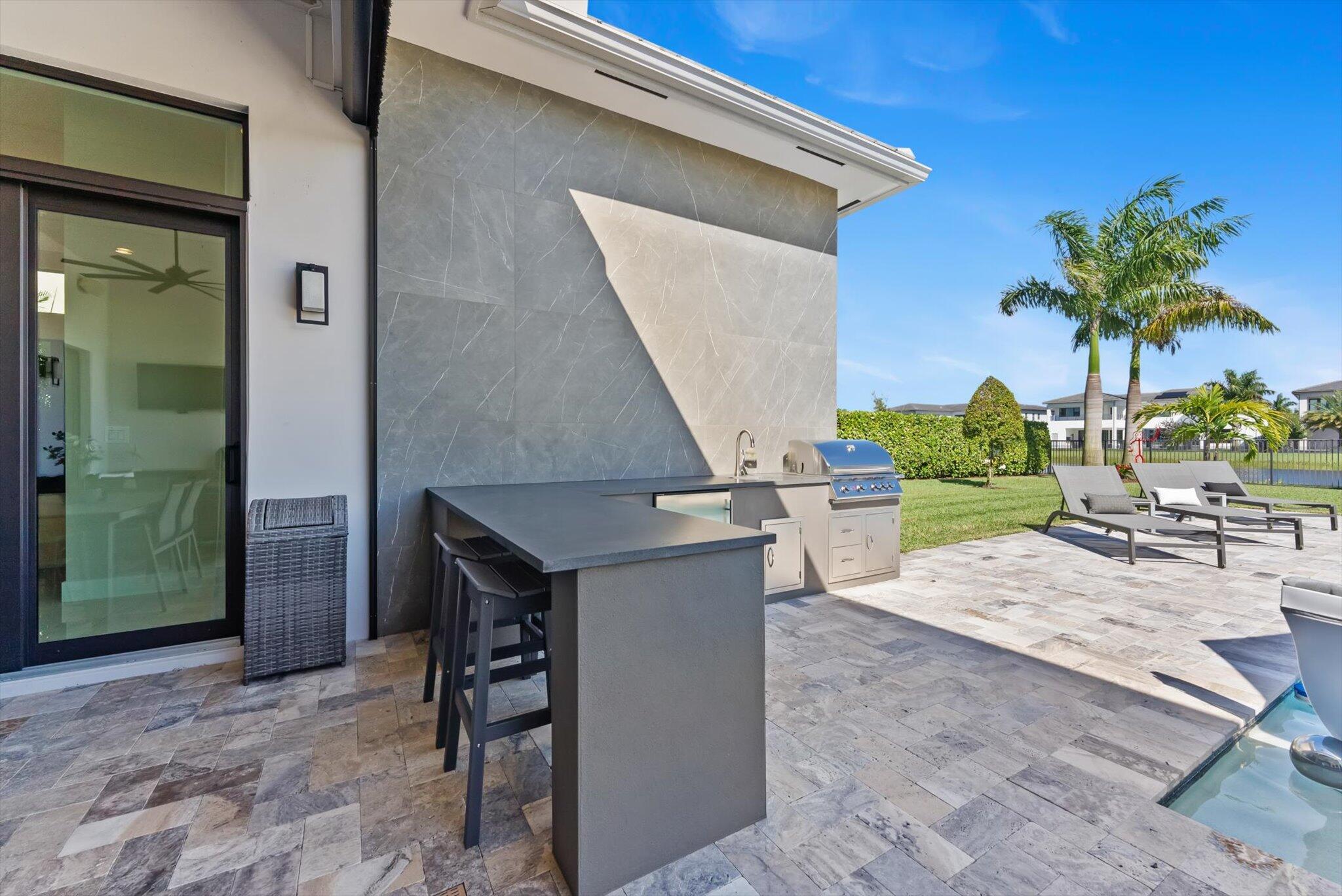 9794 Chianti Classico Terrace Boca Raton, FL 33496 - Photo 91 of 118 a view of outdoor kitchen dining room and kitchen