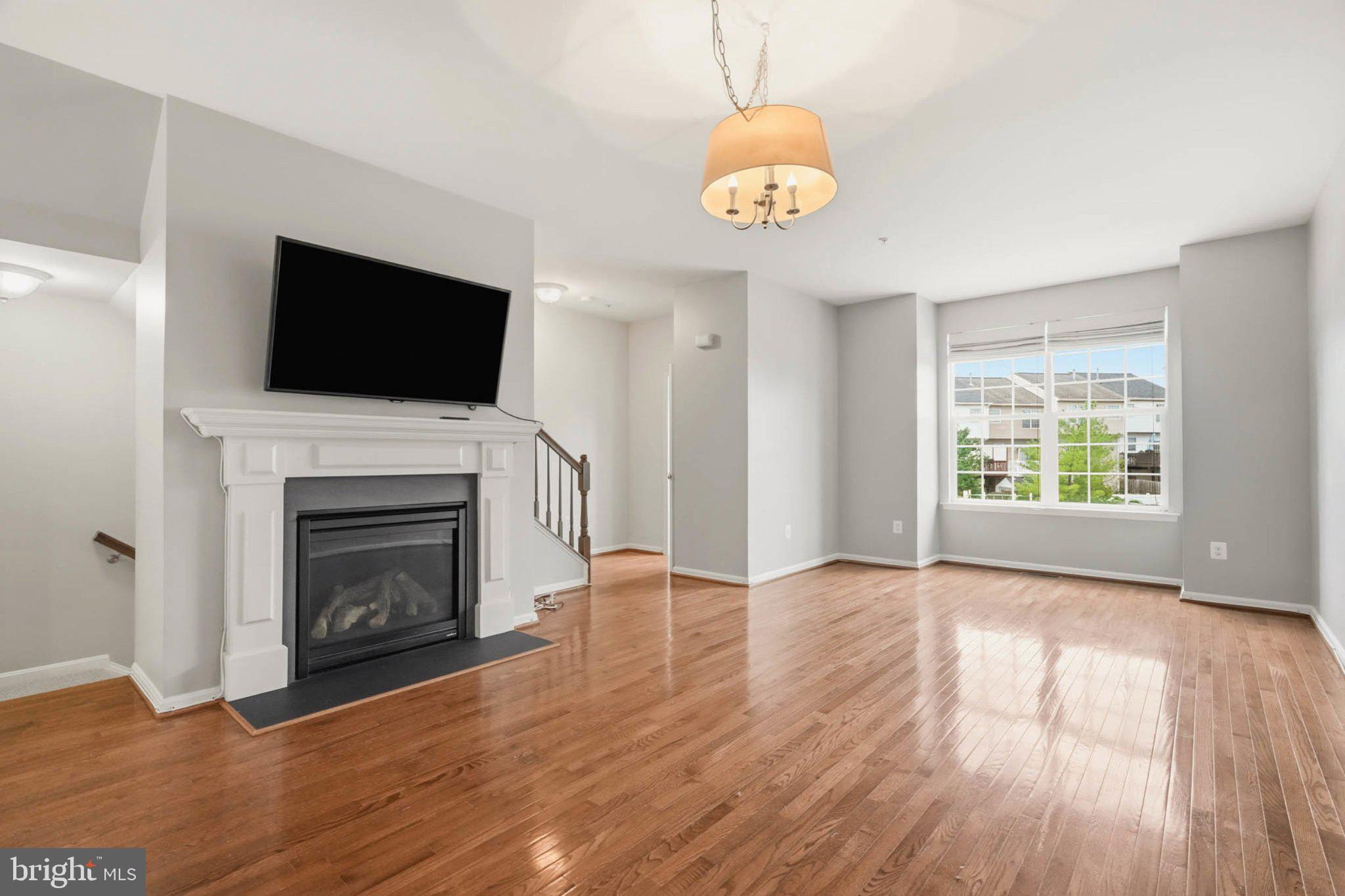 677 Tivoli Road Frederick, MD 21703 - Photo 3 of 39 Living Room/Dining Area w/ gas fireplace