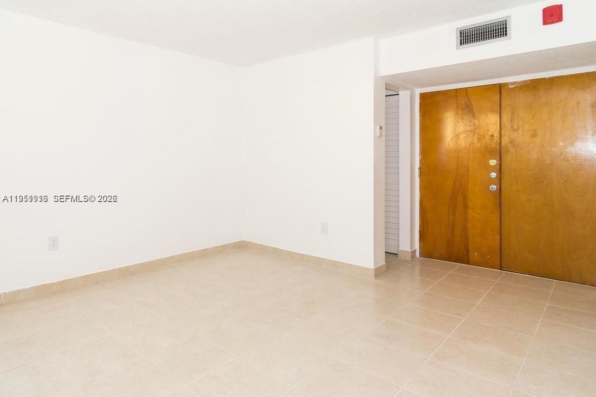 11750 Southwest 18th Street, Unit 1221 Miami, FL 33175 - Photo 5 of 6 a view of an empty room