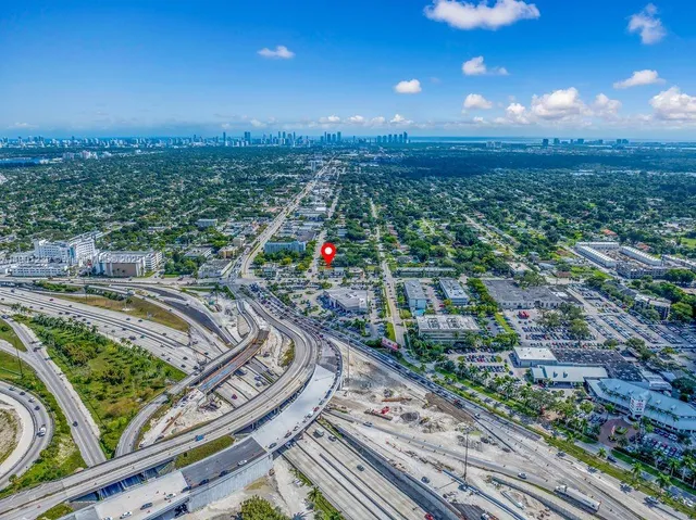 an aerial view of a house with a yard and garden