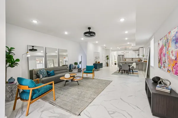 a living room with furniture and flat screen tv