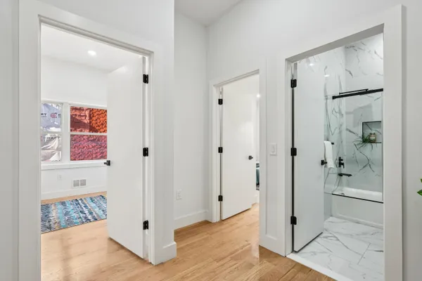a view of an entryway with wooden floor