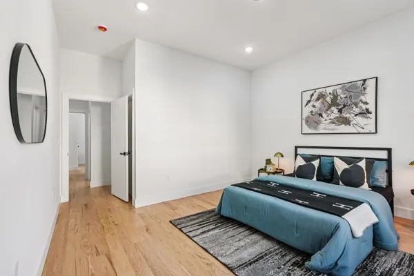 a bedroom with bed and a window