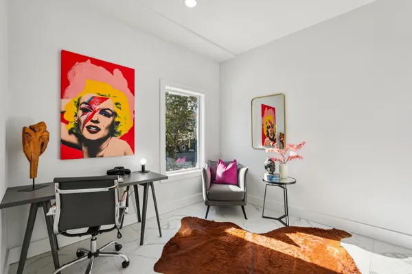 a living room with furniture and a gate