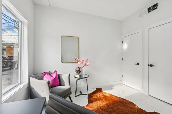 a living room with furniture and a rug