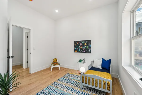 a living room with furniture and a rug