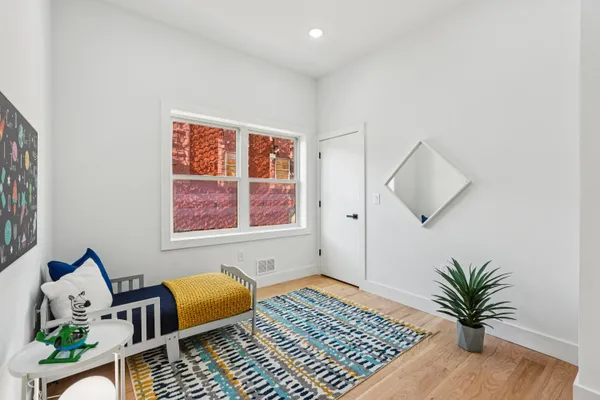 a living room with furniture and flowers