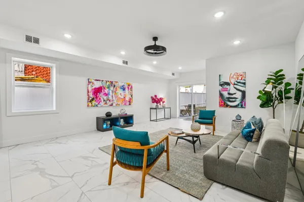 a living room with furniture and a rug