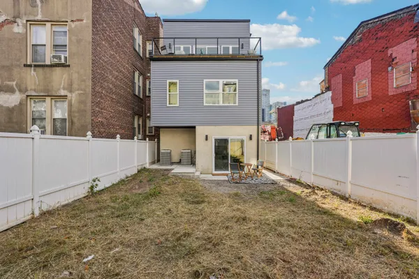 a front view of a house with a garage