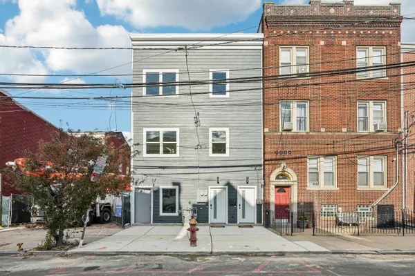 a front view of a building with street view