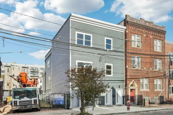 a view of a brick building with many windows